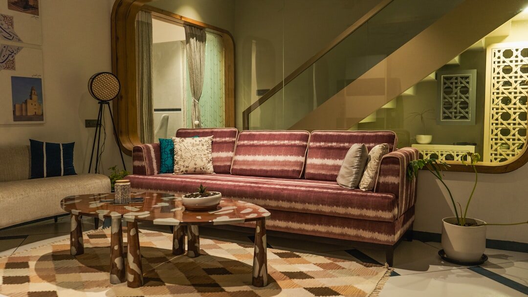 Elegant vintage-style celebrity living room with a velvet sofa and brass accents
