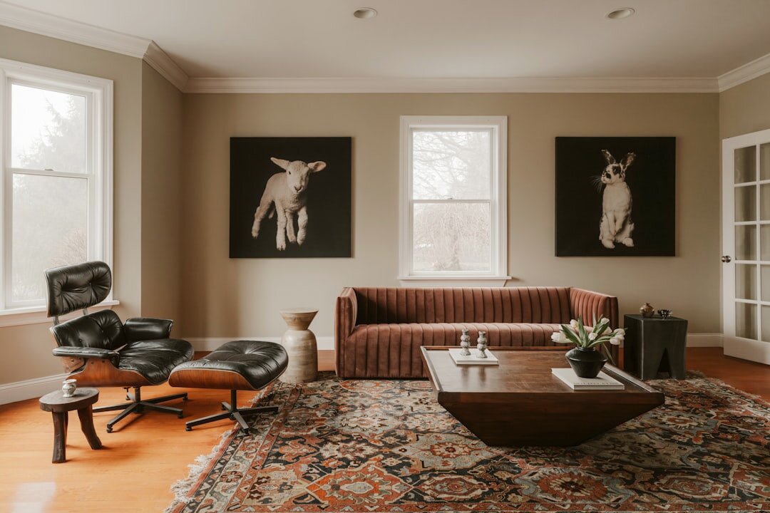 Retro styled living room with patterned wallpaper and mid-century furniture