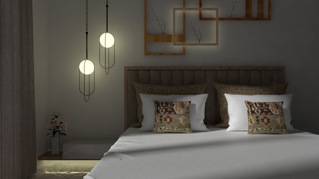 Elegant vintage bedroom with an upholstered headboard and warm lighting