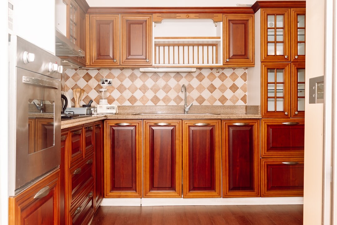 Luxury retro kitchen with wooden cabinets and brass fixtures